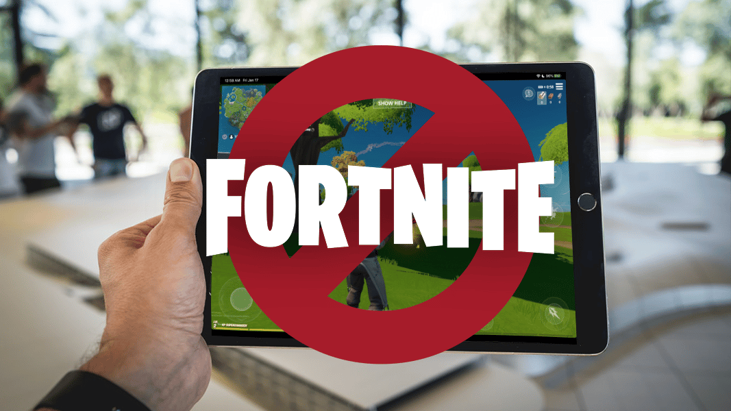 Fortnite logo over hand holding ipad pro