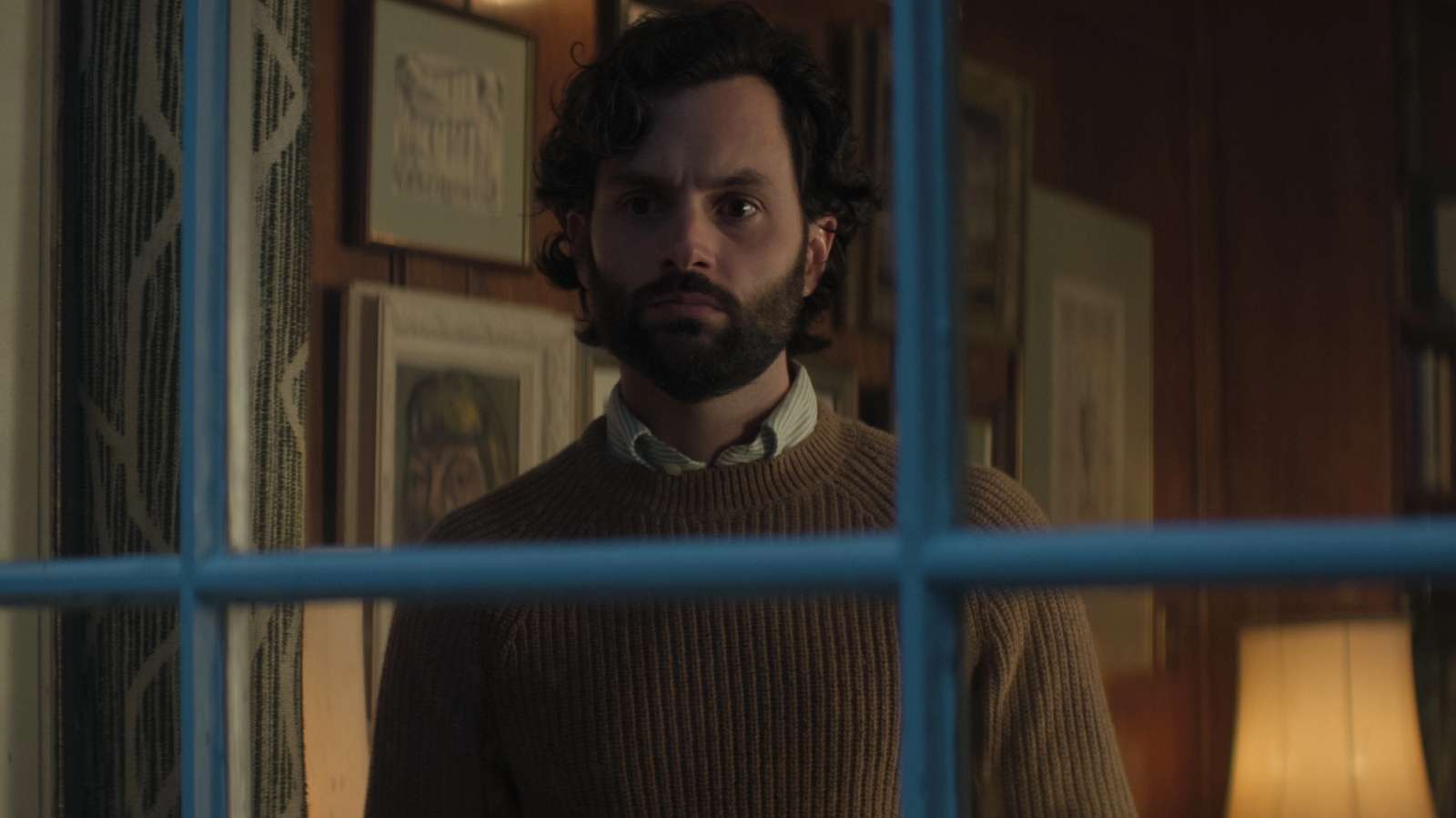 Joe Goldberg staring out of window in You Season 4