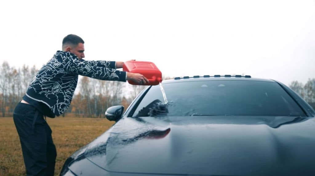 Pouring gasoline on a mercedes