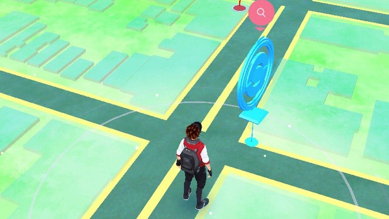 An image of a trainer standing by a PokeStop in Pokemon Go