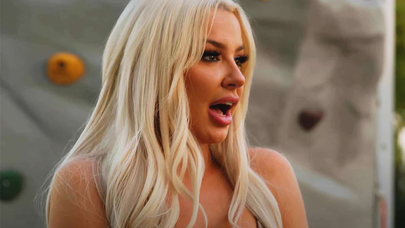 An image of Tana Mongeau on the show Reality House.