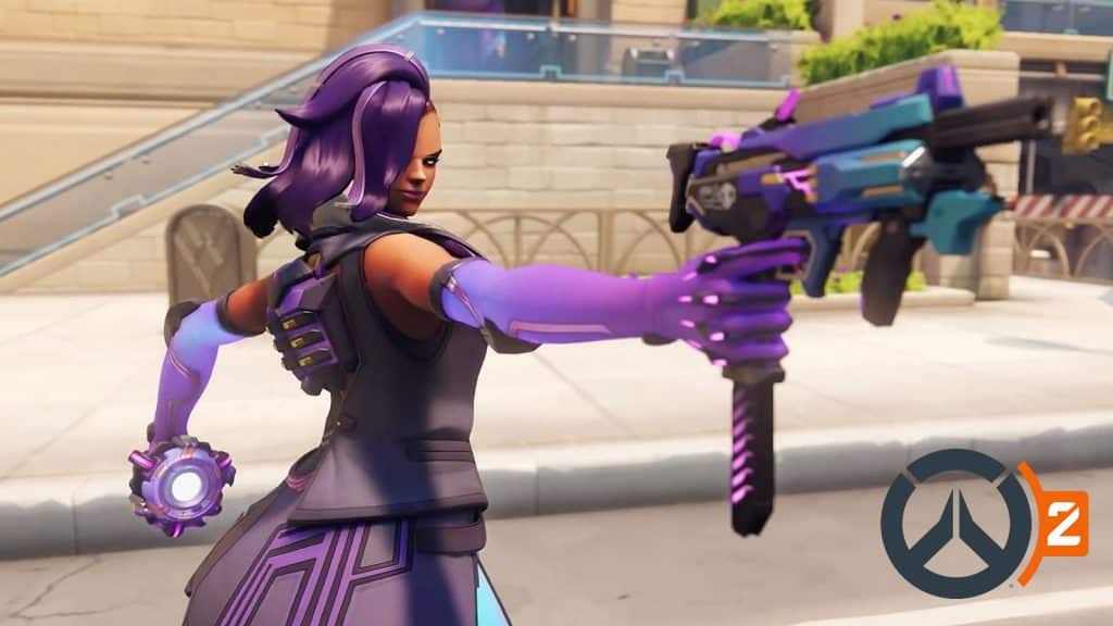 overwatch 2 sombra with machine pistol aimed at camera
