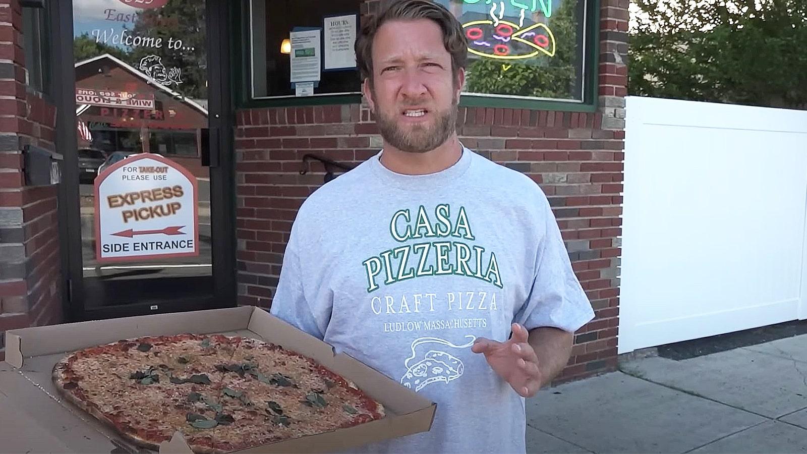 Dave Portnoy with a pizza