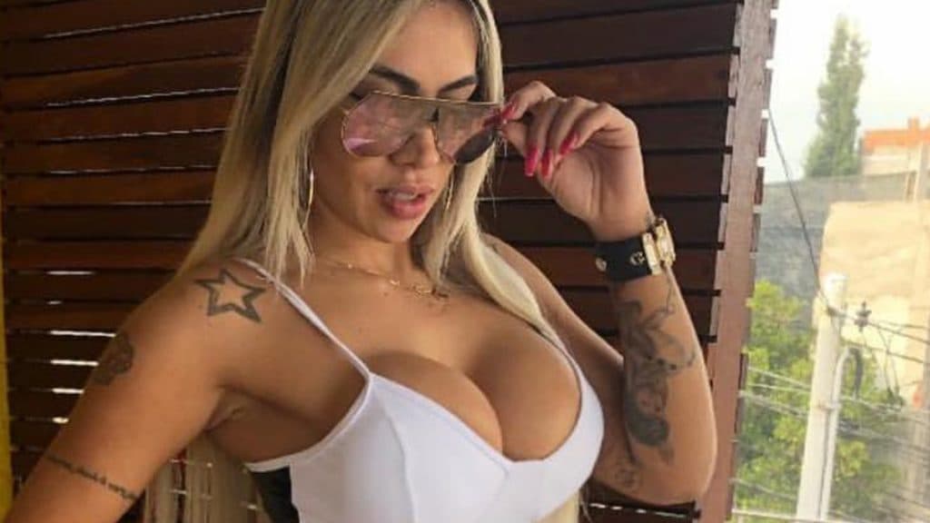 onlyfans model poses with sunglasses