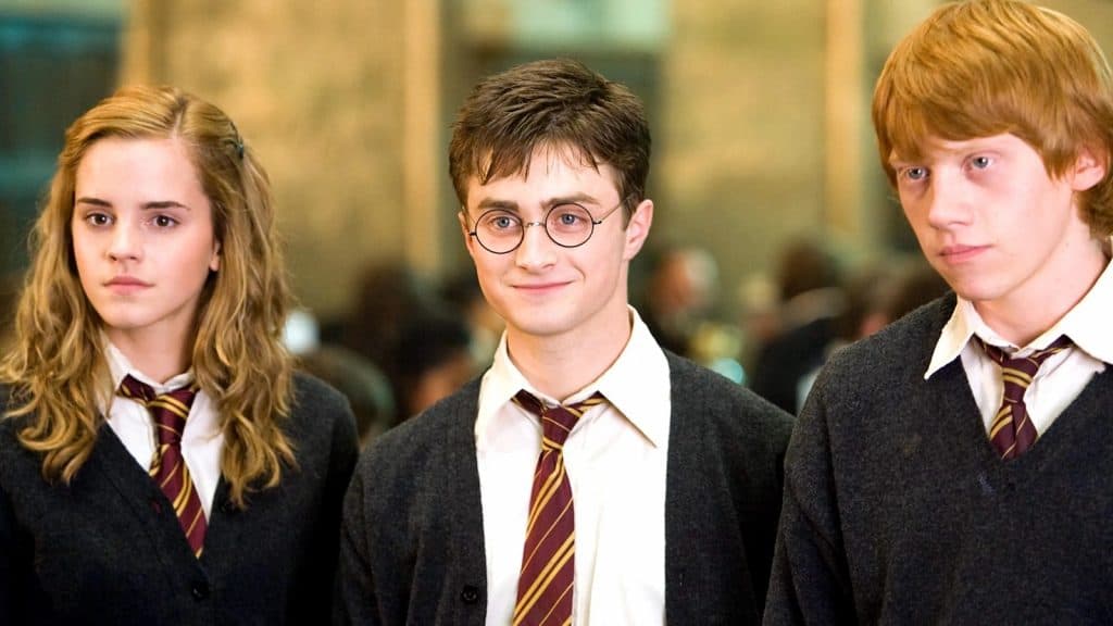 Emma Watson, Daniel Radcliffe and Rupert Grint as Hermione Granger, Harry Potter and Ron Weasley