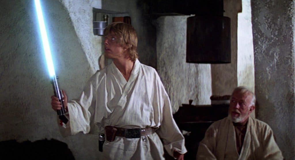 Lukę Skywalker wielding his lightsaber in Star Wars