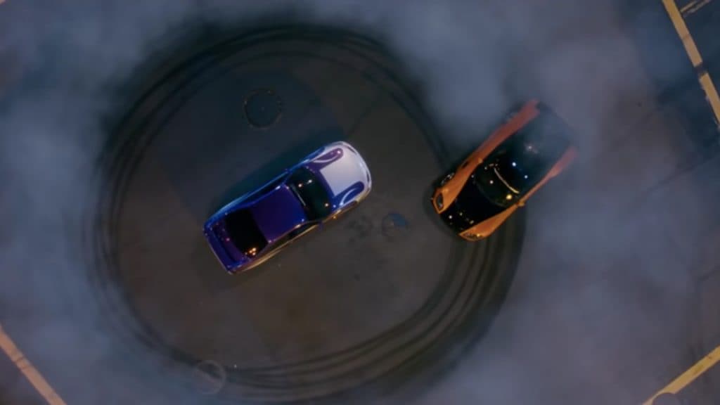 Two cars race in an empty street in The Fast and the Furious: Tokyo Drift