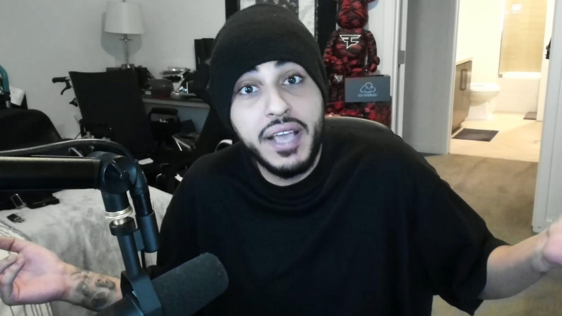 FaZe Rain in black t shirt and hat talking to camera