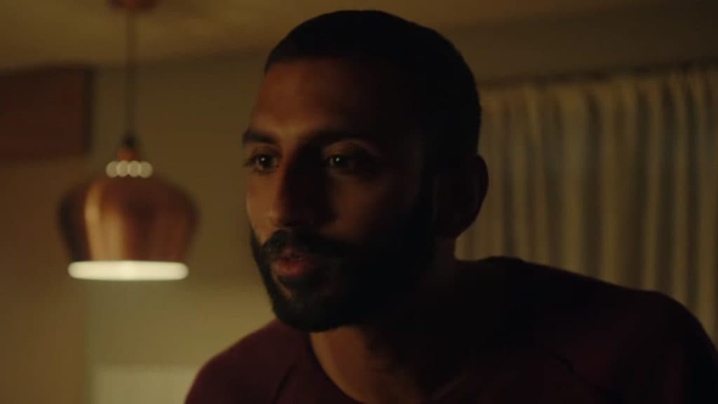 A close up of Avi Nash in Black Mirror