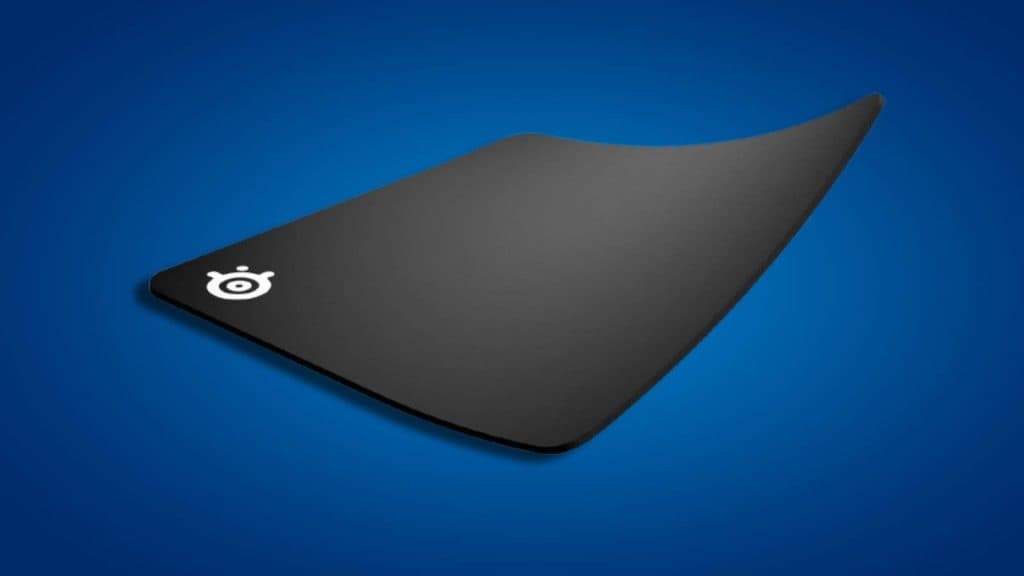 Image of the SteelSeries QcK Gaming Mouse Pad on a blue background.