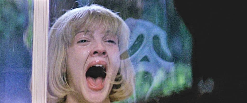 Drew Barrymore and Ghostface in Scream
