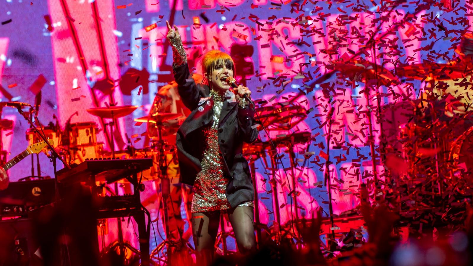 Paramore performs onstage at a concert