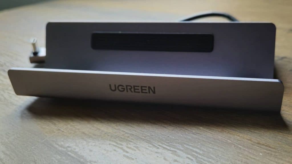 Image of the UGreen Steam Deck dock on a wooden table.