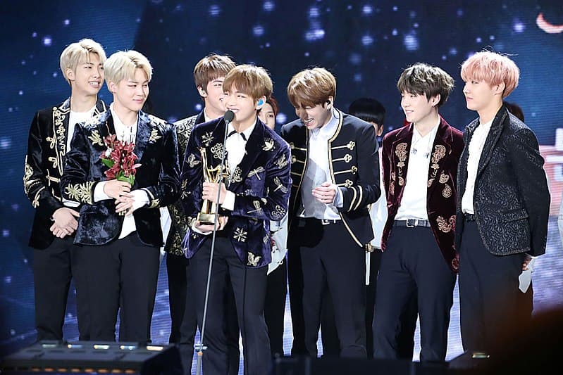 BTS kpop group accepting award.