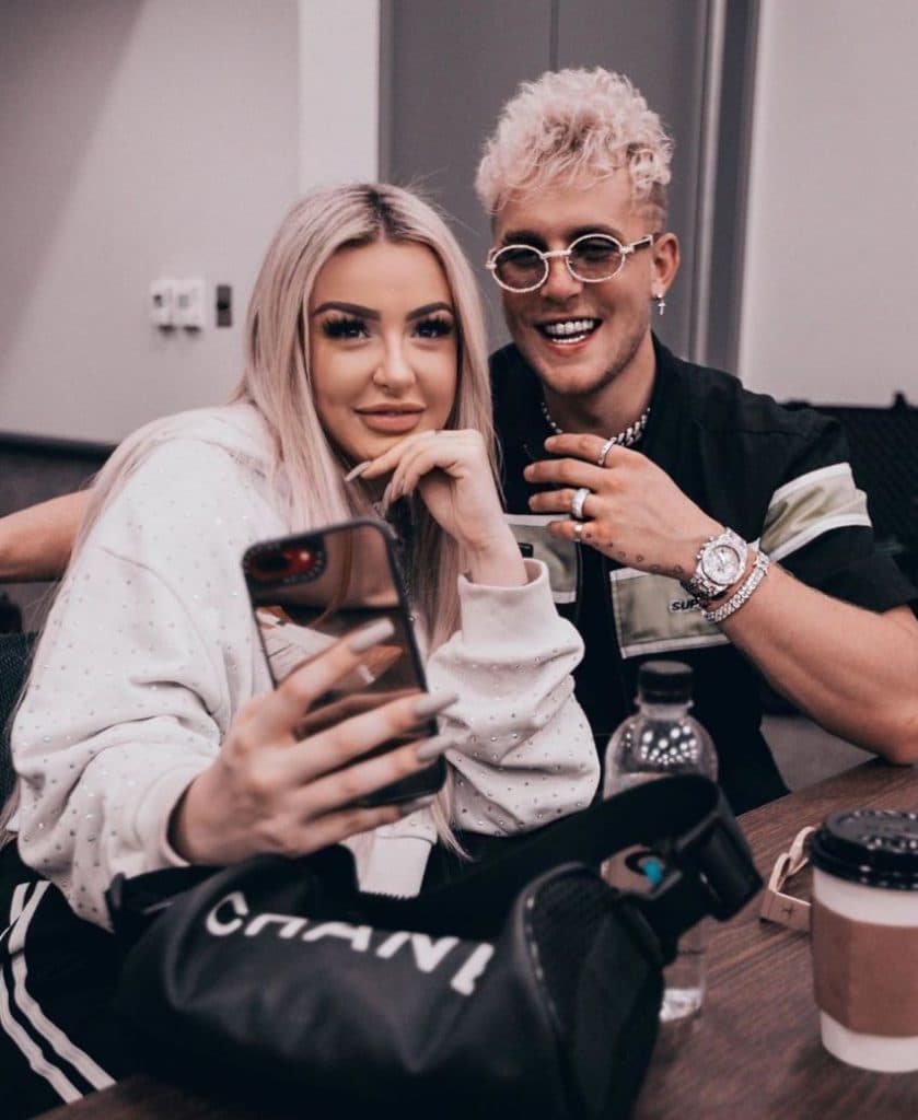 Tana Mongeau and Jake Paul pose for a selfie.