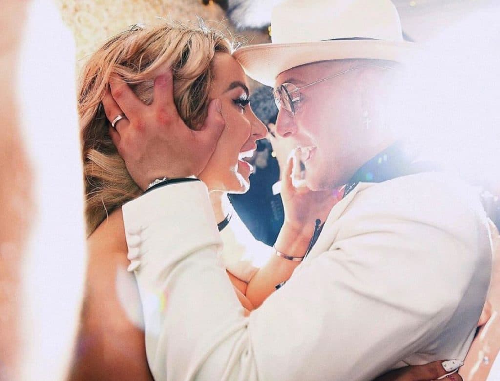 Tana Mongeau embraces her hubby Jake Paul on their wedding day.