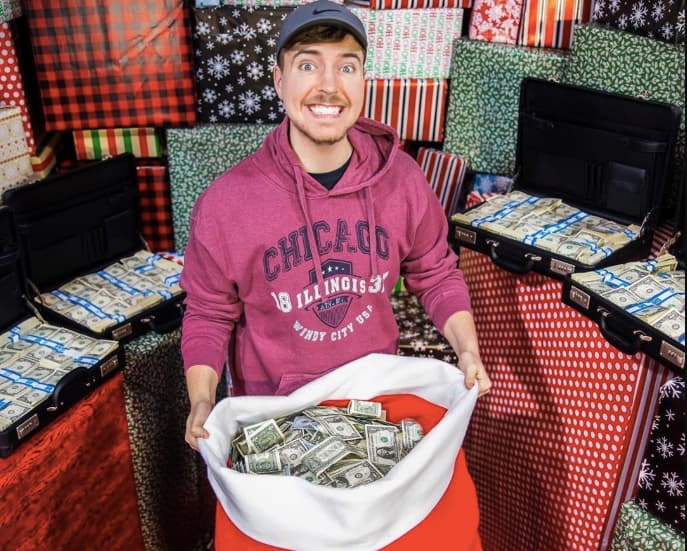 Image of MrBeast holding sack of money