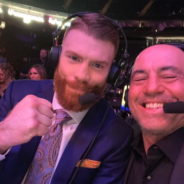 Joe Rogan commentating at a UFC event with Paul Felder.