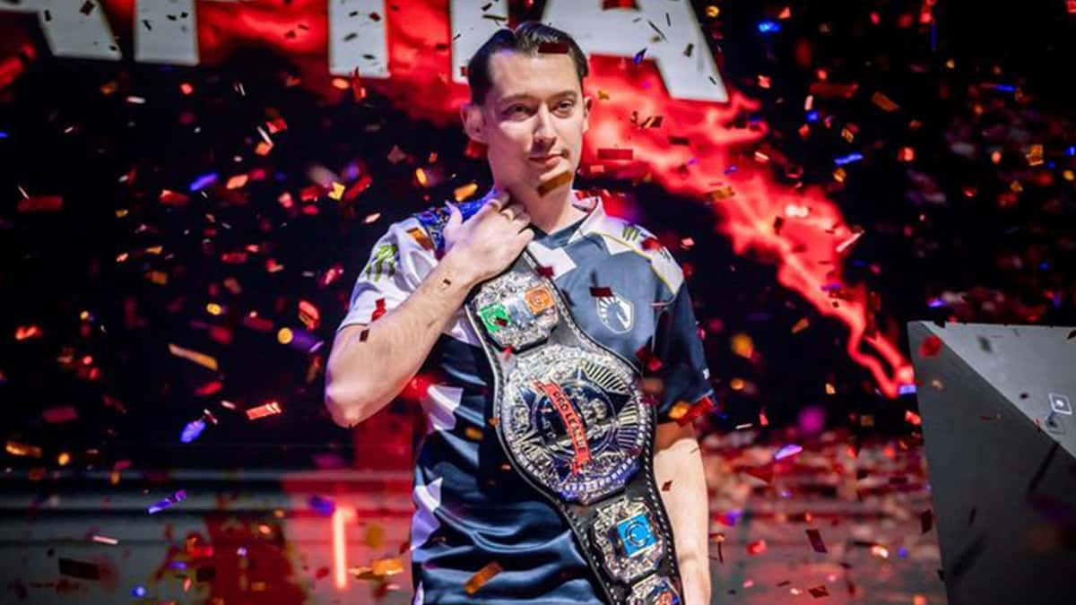 Rapha holding the Quake World Championship title belt.