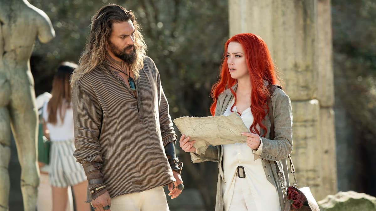 Amber Heard alongside co-star Jason Mamoa in Aquaman.