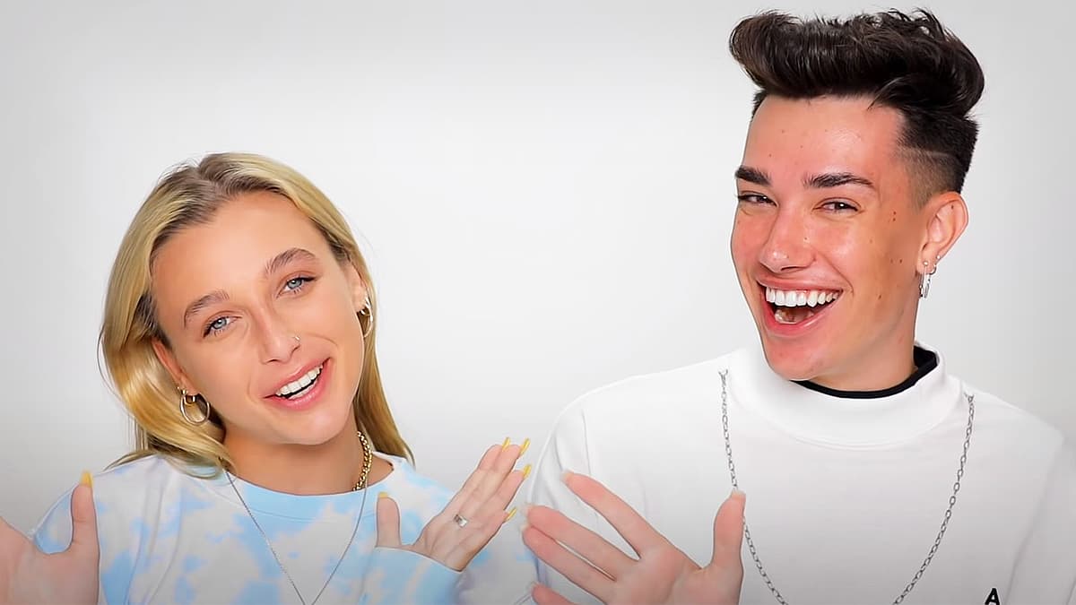 James Charles and Emma Chamberlain wave at the camera