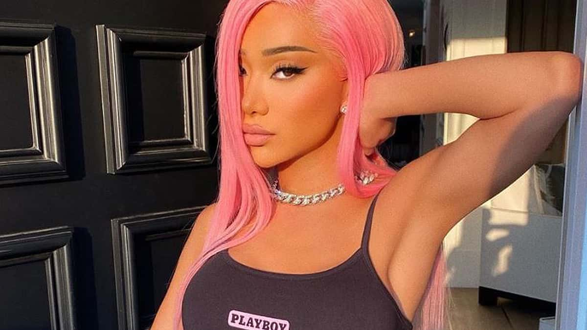 Nikita Dragun poses in a doorway.