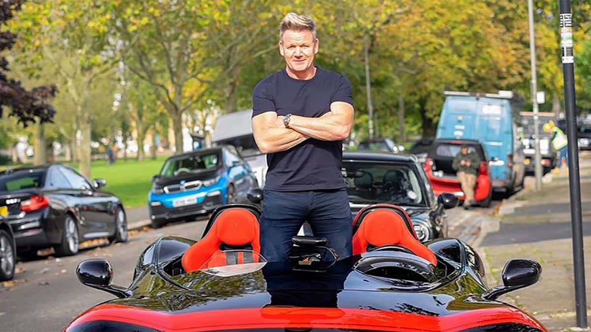 Gordon Ramsay standing in car