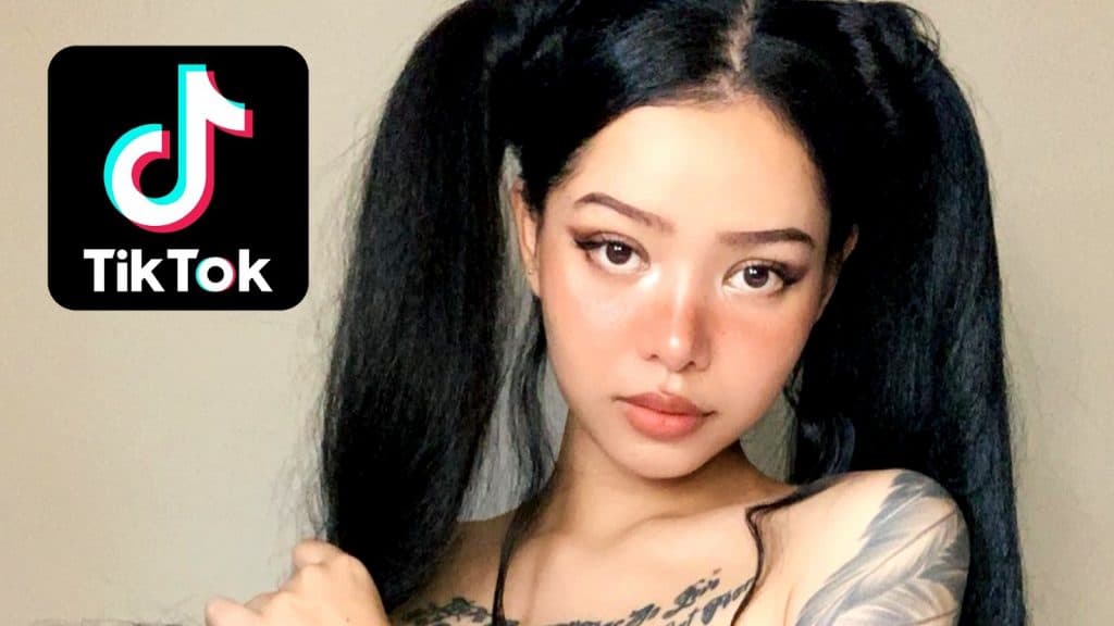 Bella Poarch faces the camera next to a TikTok logo