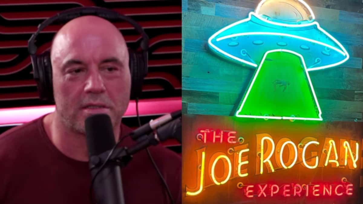 Joe Rogan next to the neon light for his new studio