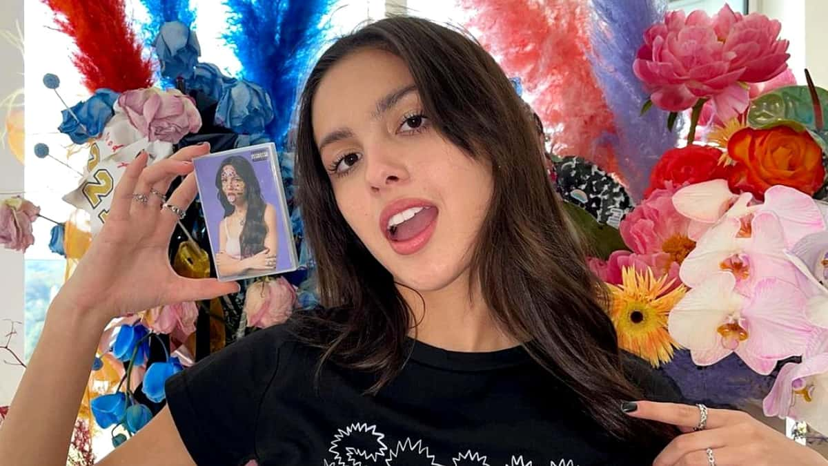 Olivia Rodrigo holds her album