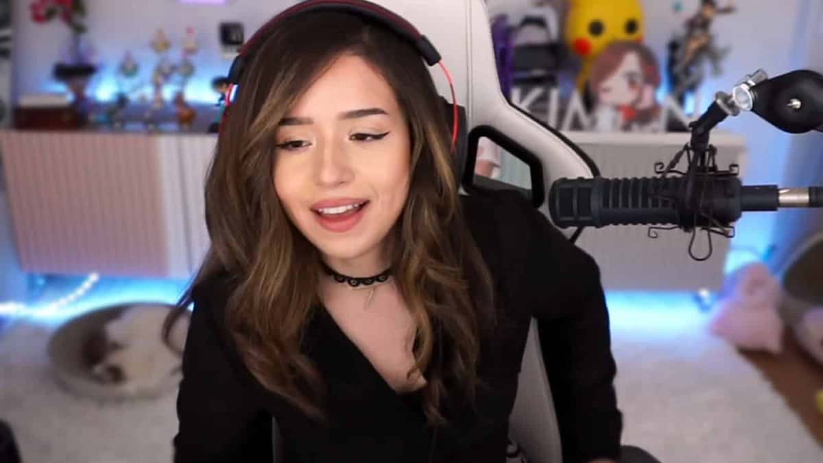 Pokimane smiles on Twitch stream.