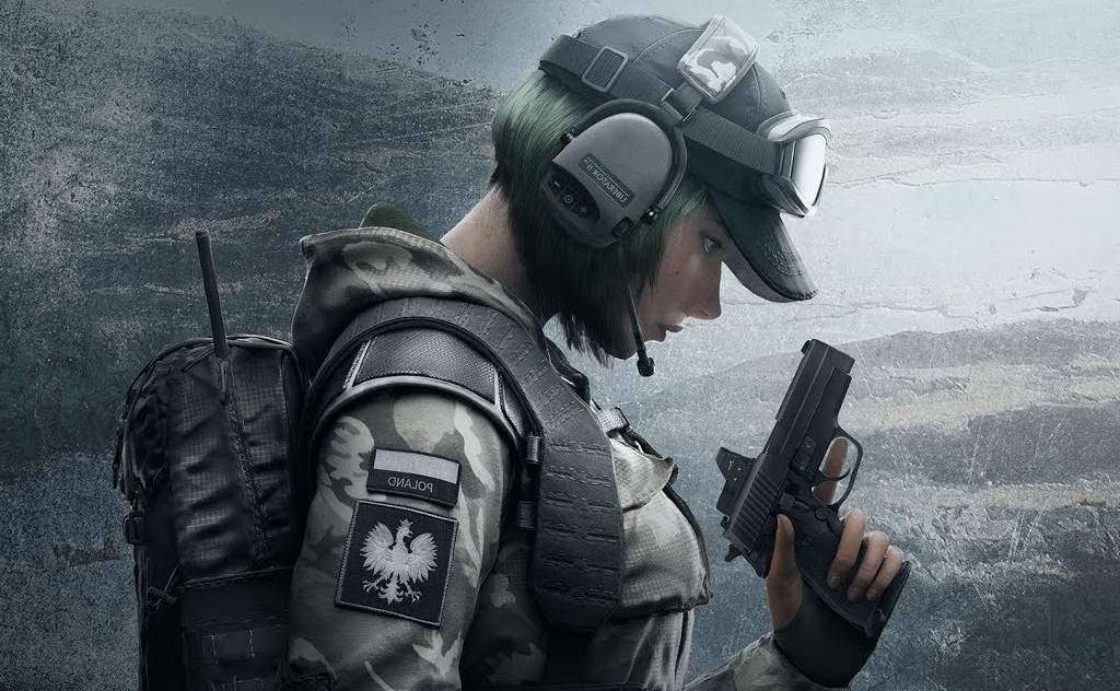 Ela looking down at pistol in rainbow six siege