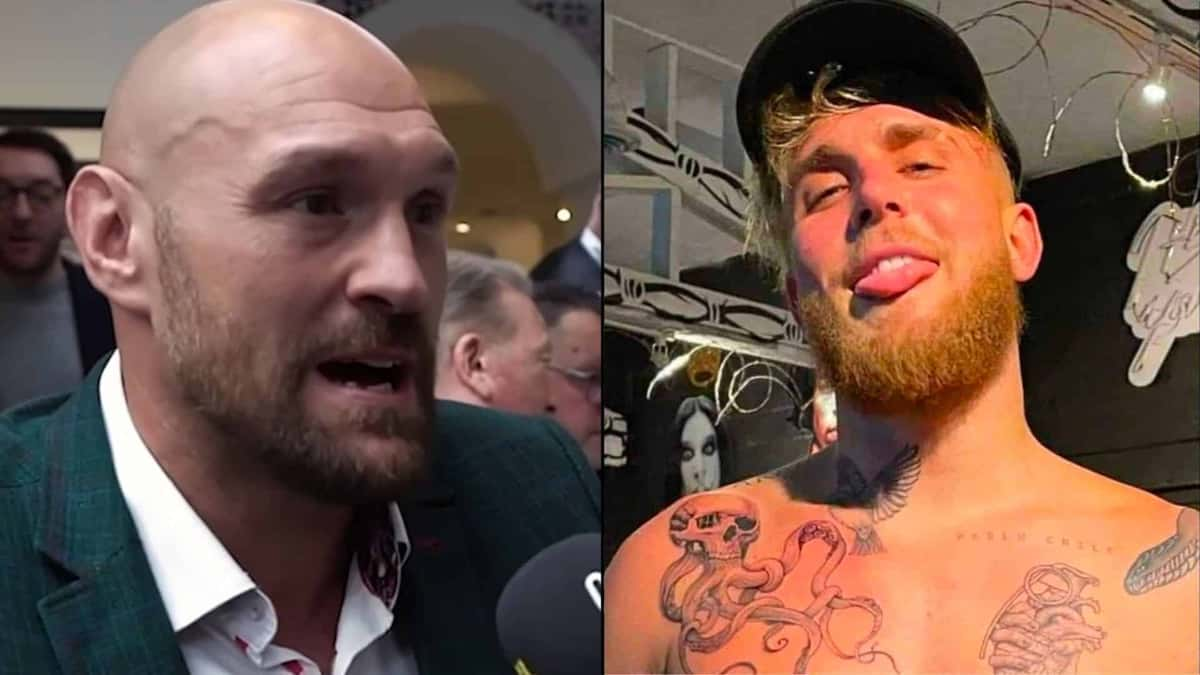 Tyson Fury talking to mic alongside Jake Paul posing in boxing gym