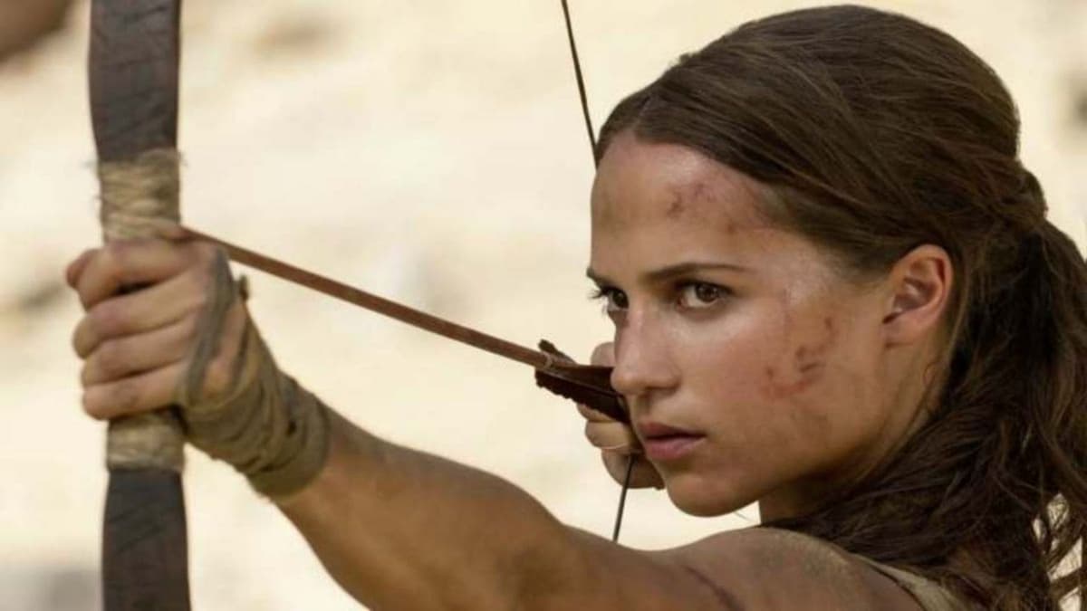 alicia vikander firing bow as lara croft in tomb raider movie