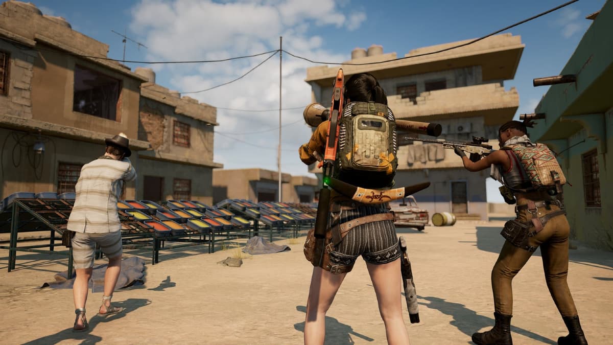 Three players exploring an area in PUBG gameplay