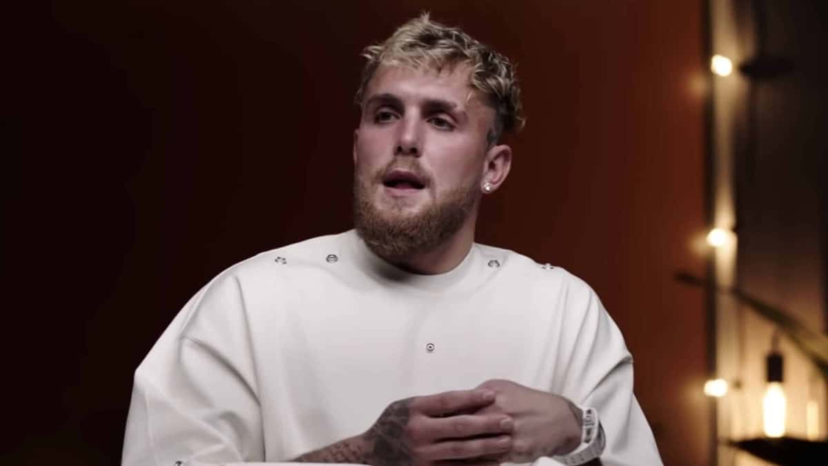 Jake Paul in white shirt talking to camera during interview