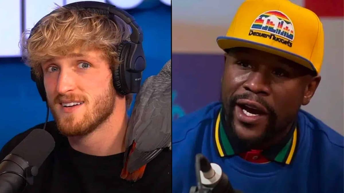 Logan Paul alongside Floyd Mayweather talking into microphone