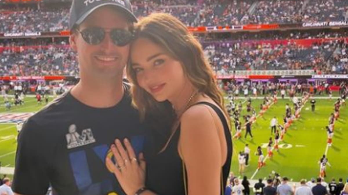 Miranda Kerr and Snapchat CEO Evan Spiegal at a football game