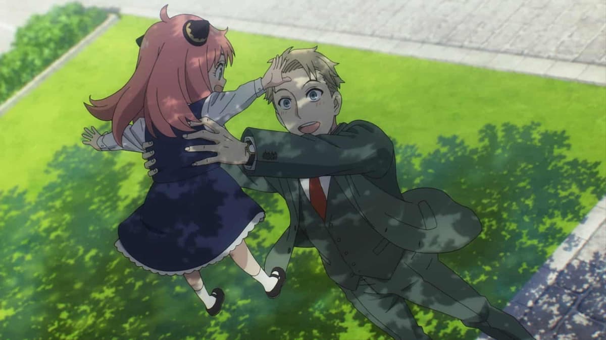 Loid holds Anya up joyfully in Spy x Family