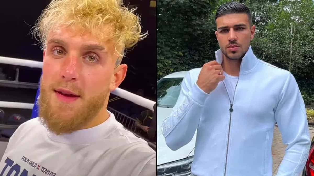 Jake Paul in boxing ring alongside Tommy Fury posing