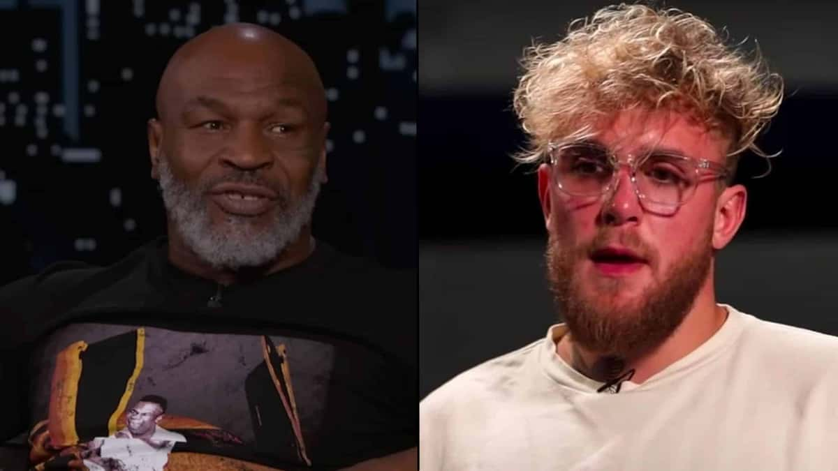 Mike Tyson talking next to Jake Paul