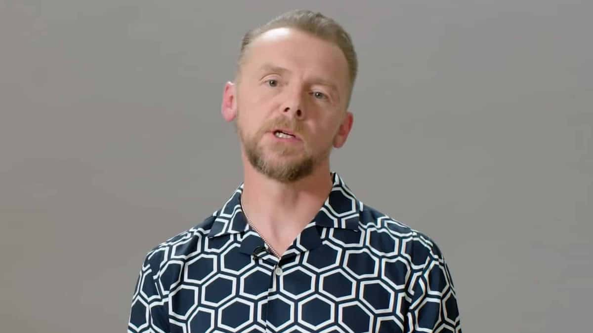 Simon Pegg wearing blue shirt