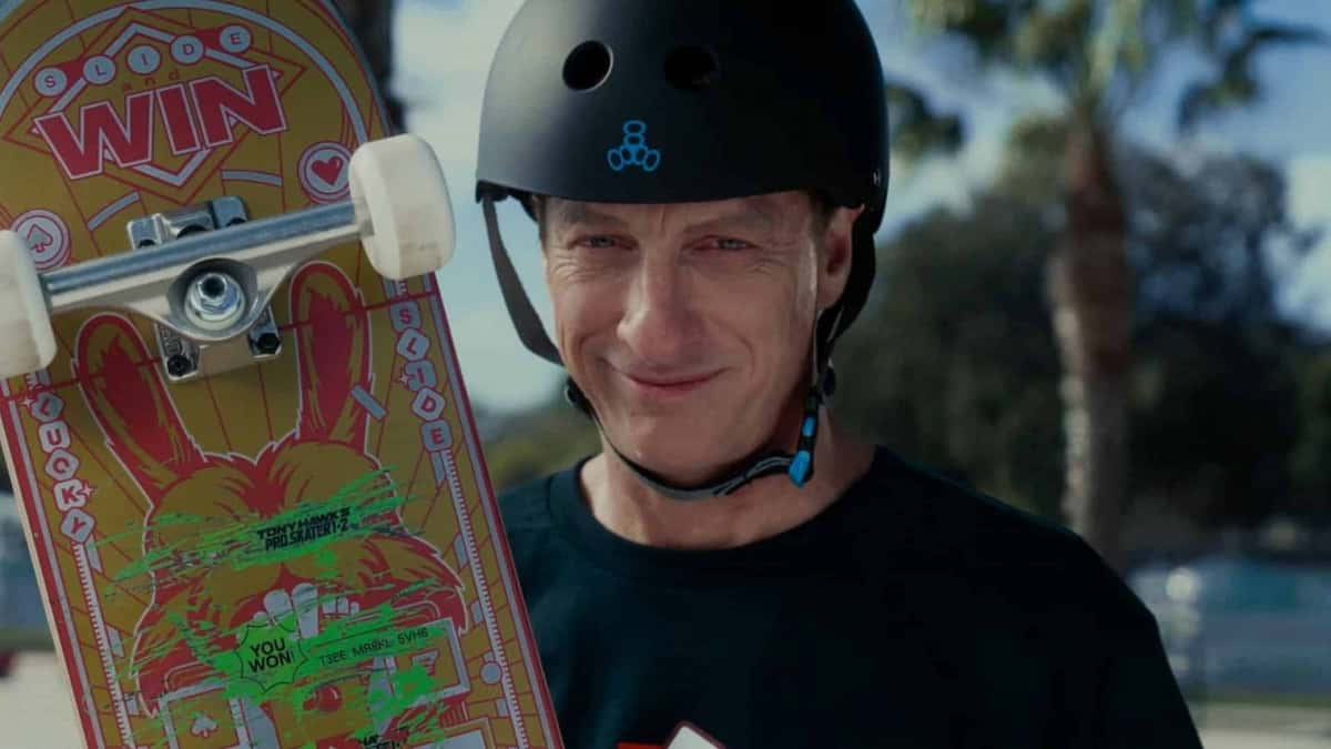 tony hawk holding up skateboard