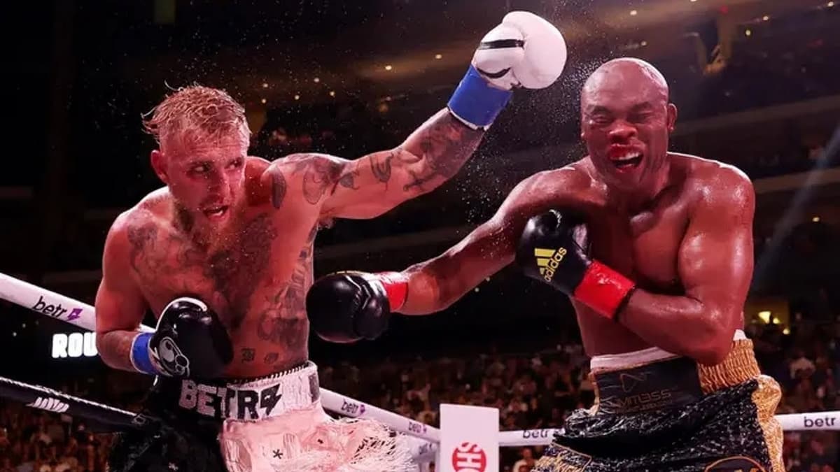 Jake Paul throwing punch at Anderson Silva in the ring