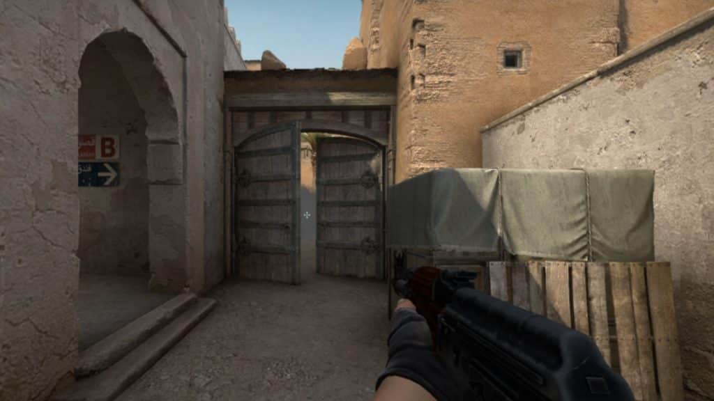 Throwing a grenade through the doors in CSGO