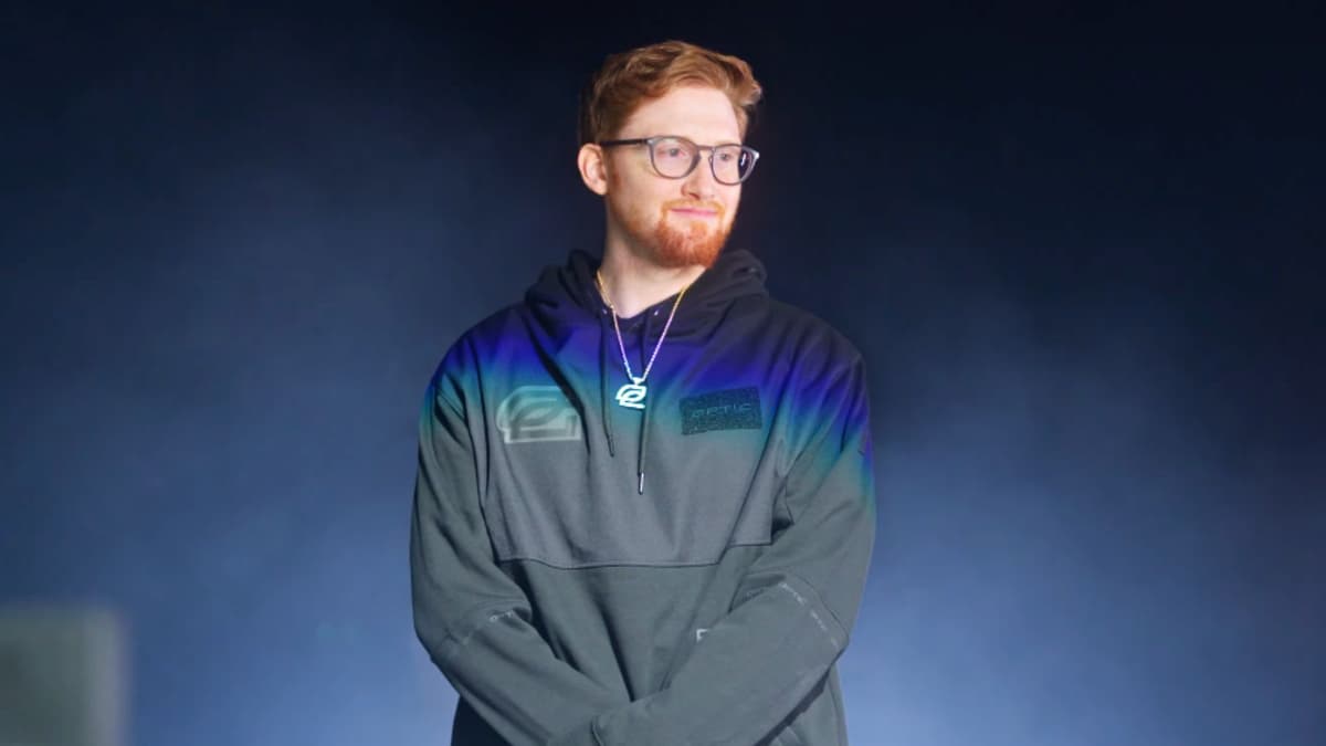 OpTic Scump standing in front of smoky background.