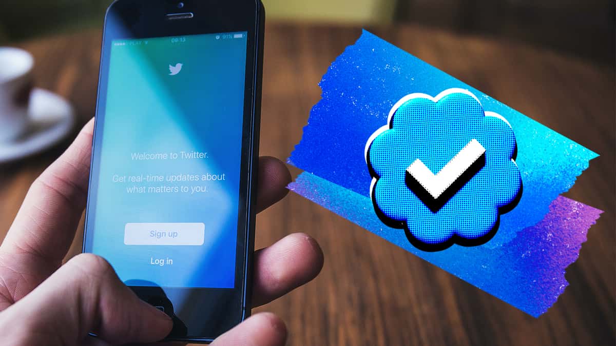 Twitter verification mark next to phone with app