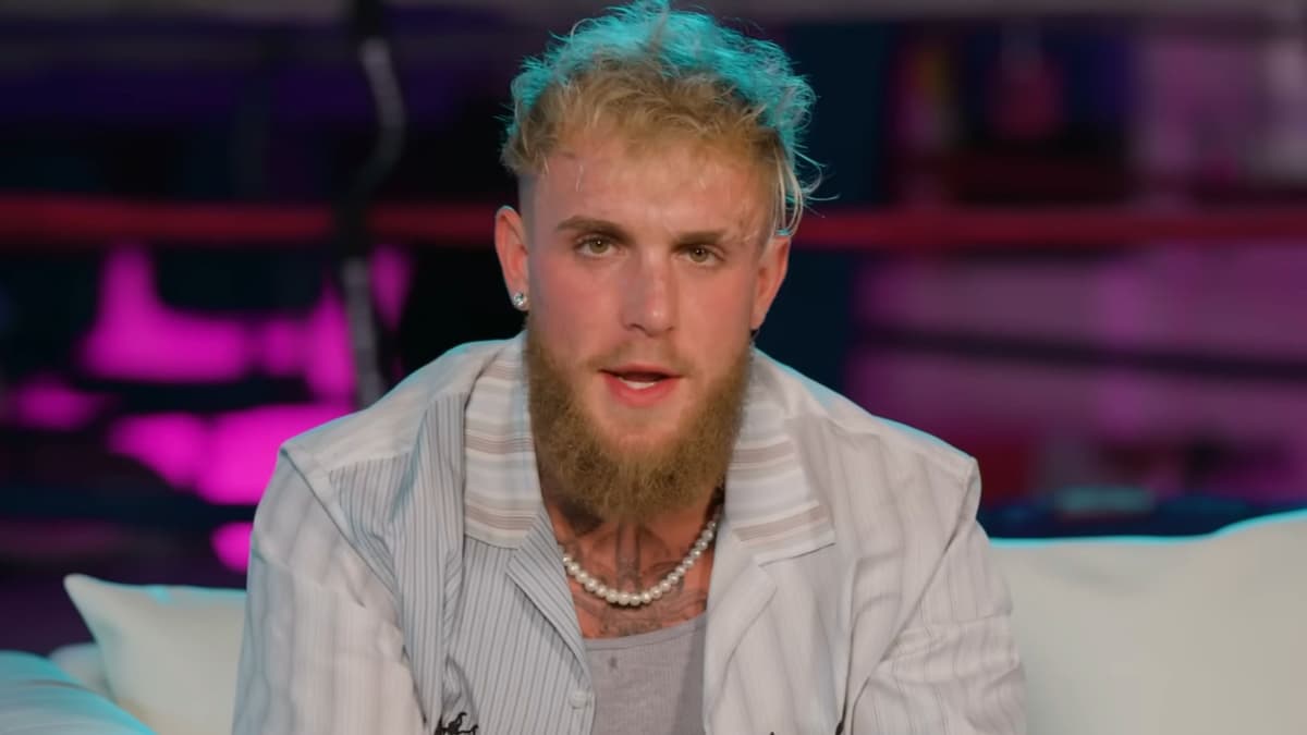 Jake Paul talking to camera in baseball shirt