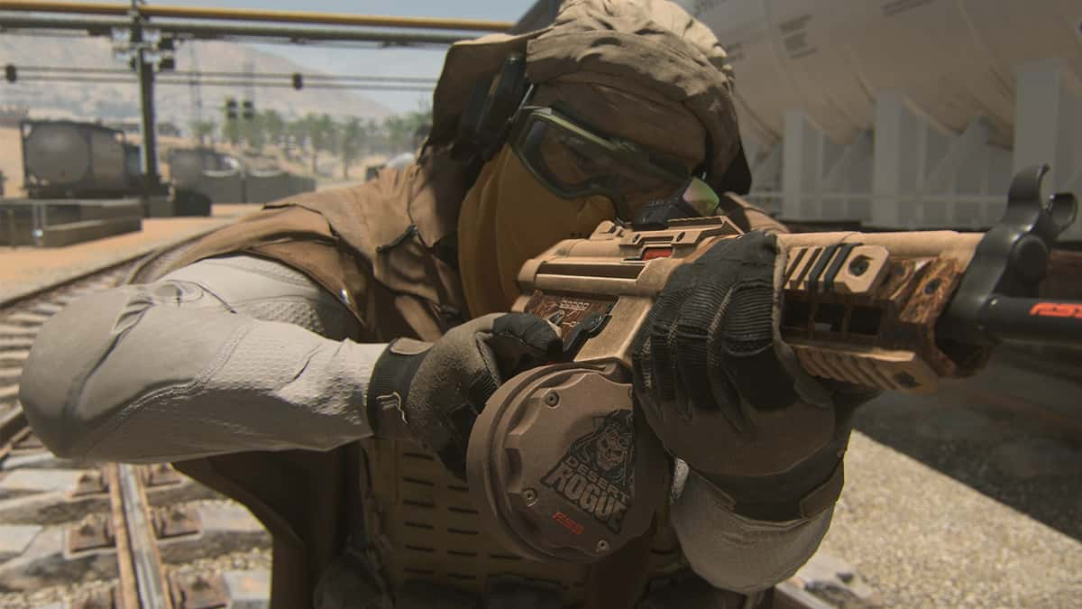 A Warzone 2 operator staring down the sights of his weapon in Al Mazrah.