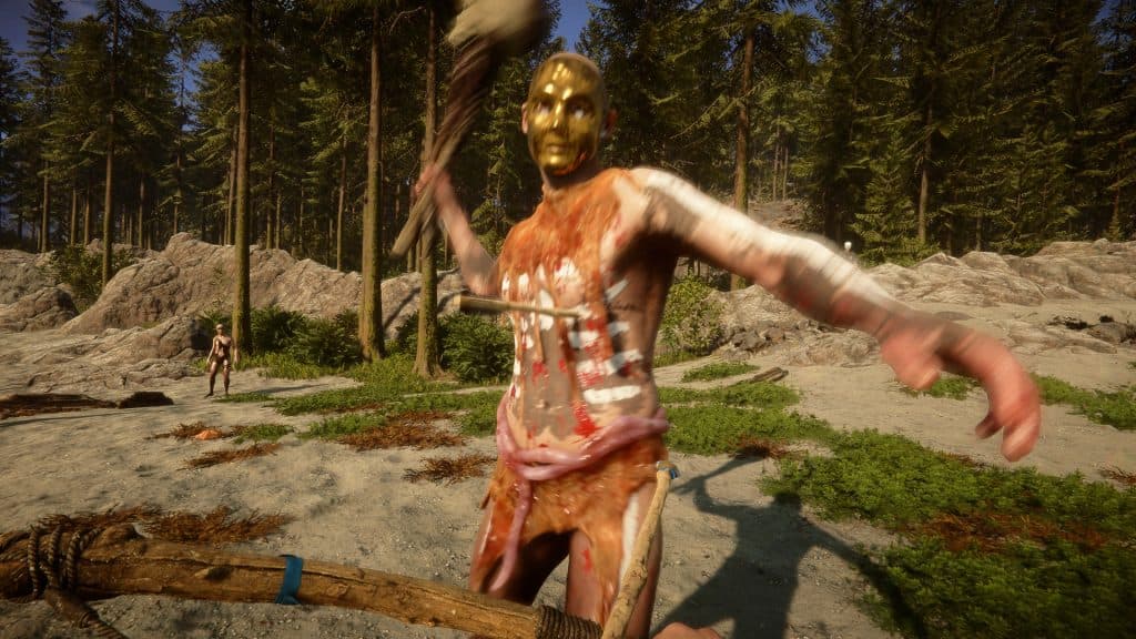 a golden masked cannibal swinging a weapon